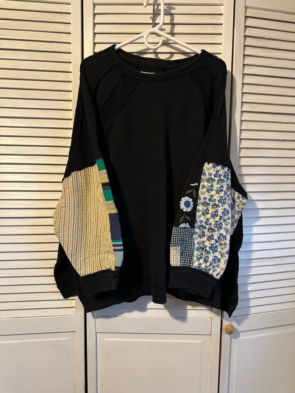 Free People Black Patchwork-Sleeve Sweatshirt with Blue Floral and Cream Accents
